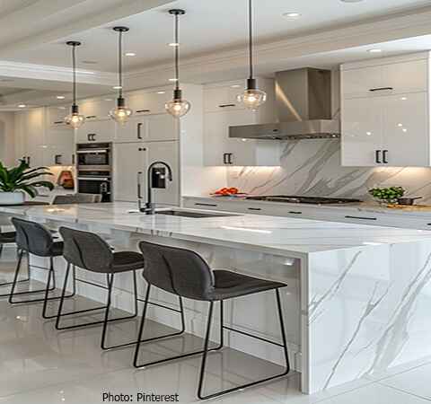 Modern kitchen featuring white cabinets and white quartz countertops by ASASA Kitchens