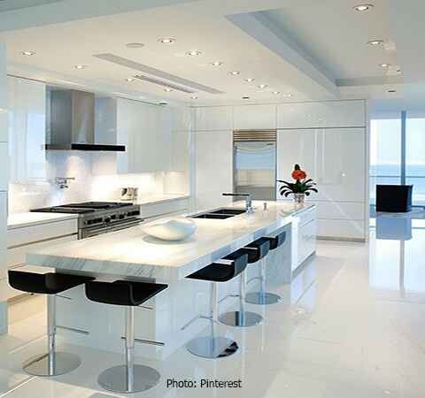 Modern kitchen featuring white cabinets and white quartz countertops by ASASA Kitchens